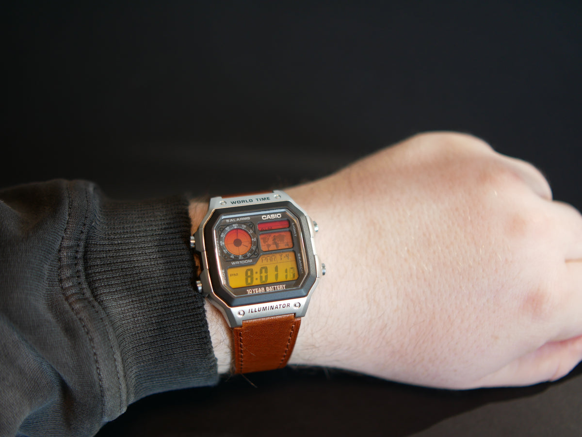 Casio AE-1200 Sunset custom watch worn on wrist with brown leather strap