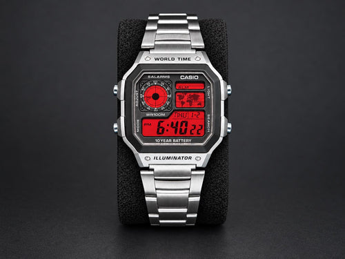 Custom Casio AE-1200 with red display and stainless-steel bracelet, shown from the front
